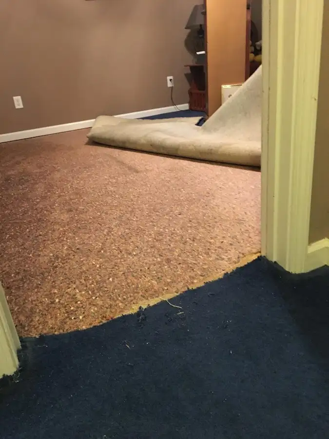 Carpet pad removal revealing water damage during Drying & Dehumidification in Somerton